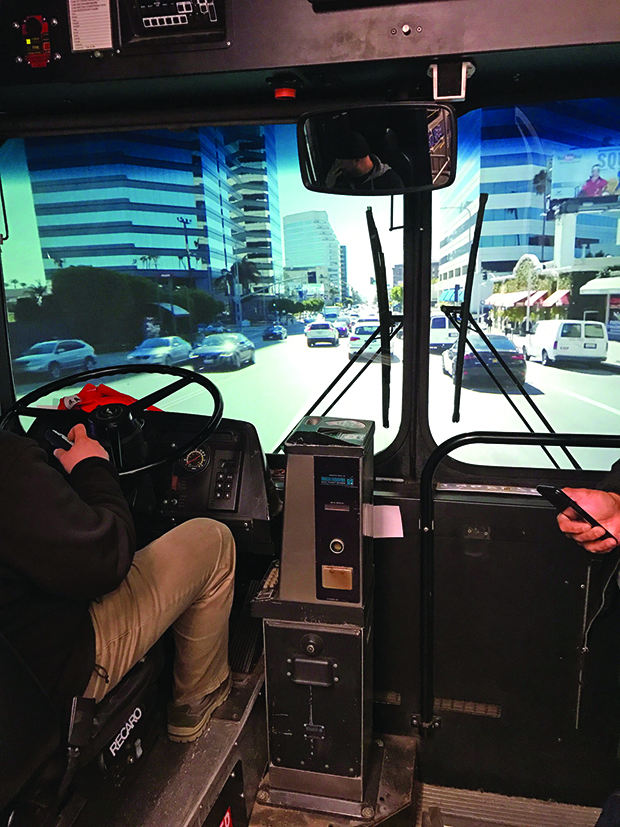 The camera’s view of projected  driving inside the bus for an episode of Curb Your Enthusiasm.